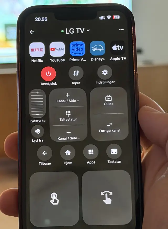The full remote screen in the app, connected to an LG TV, showing app shortcuts, power, volume and a touchpad