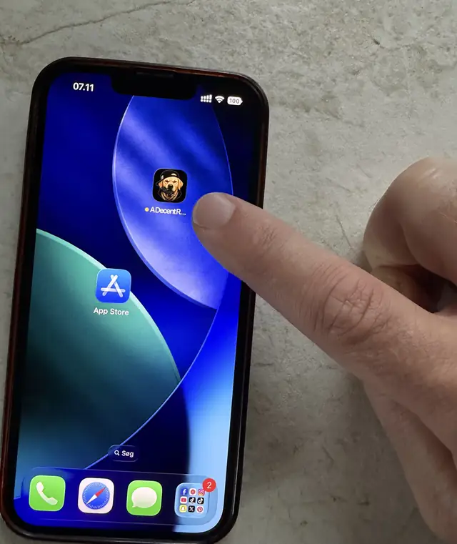 A finger tapping the newly installed A Decent Remote icon on the iPhone home screen