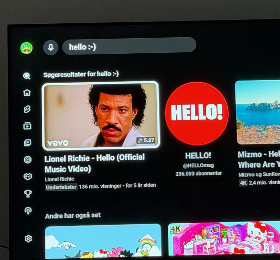 An LG TV showing a YouTube results page for the phrase that was typed on the iPhone